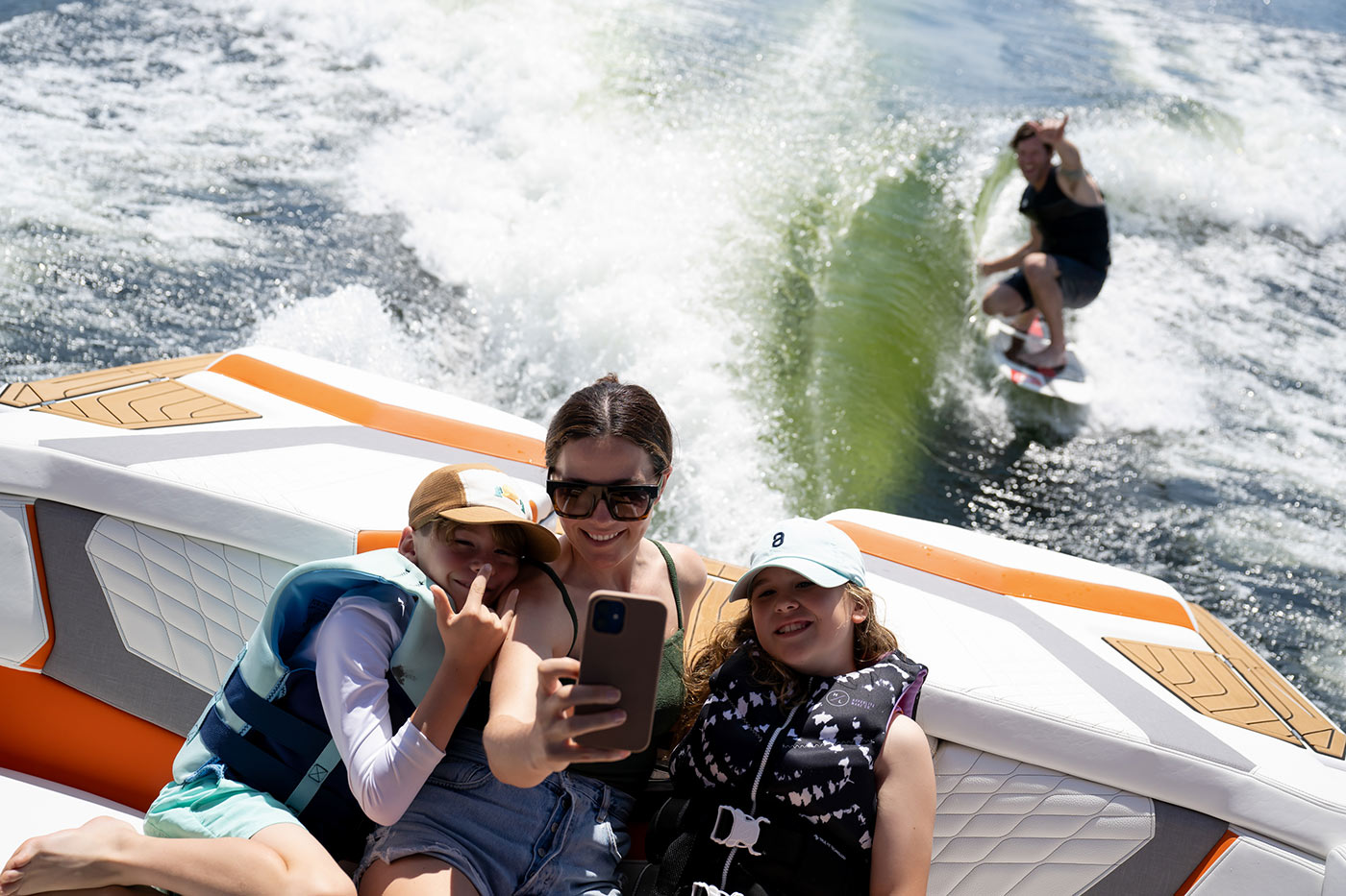 Behind the boat, together
